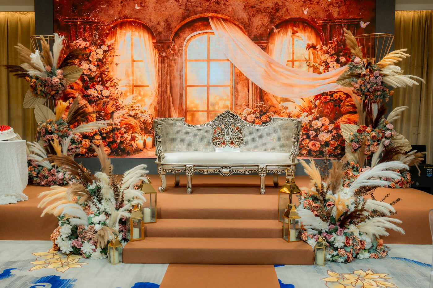 Warm wedding stage with a floral aisle inside De Villa